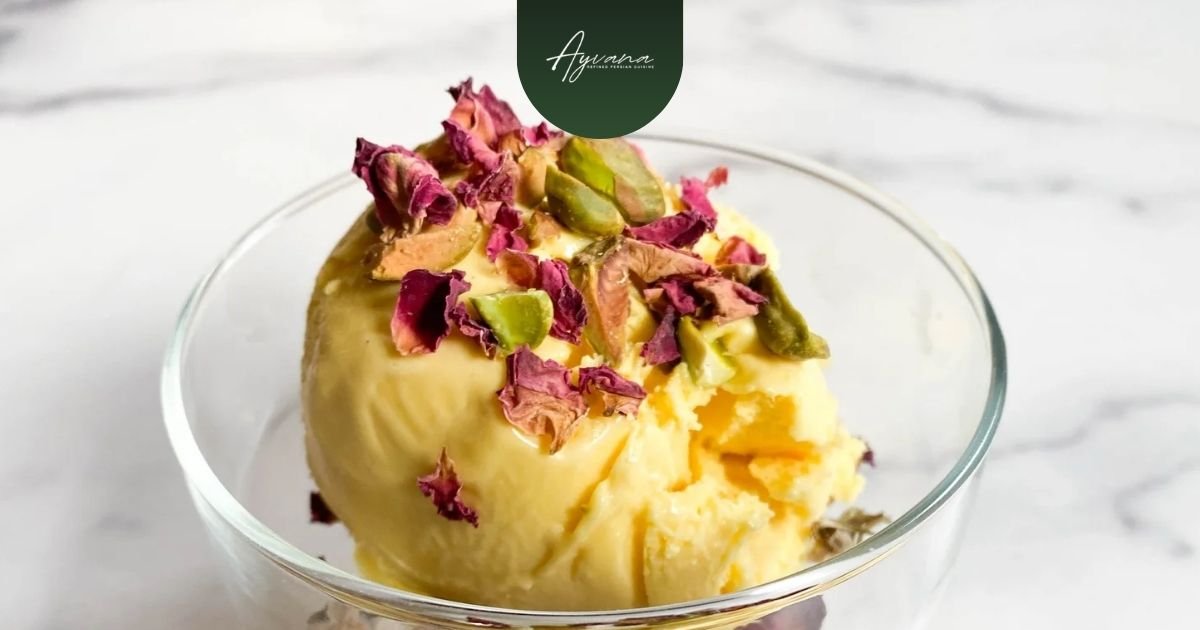 Persian bastani ice cream served in a glass bowl topped with dried rose petals and pistachios