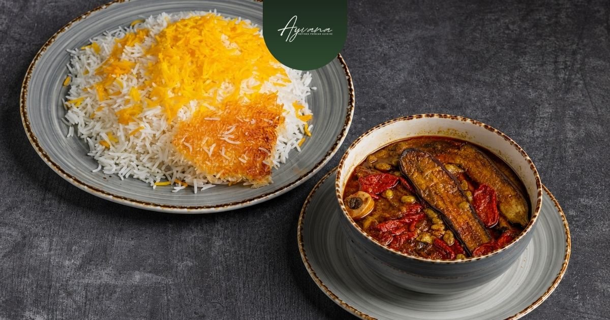 Traditional Khoresh Bademjan eggplant stew served beside Persian saffron rice with crispy tahdig on rustic ceramic tableware.