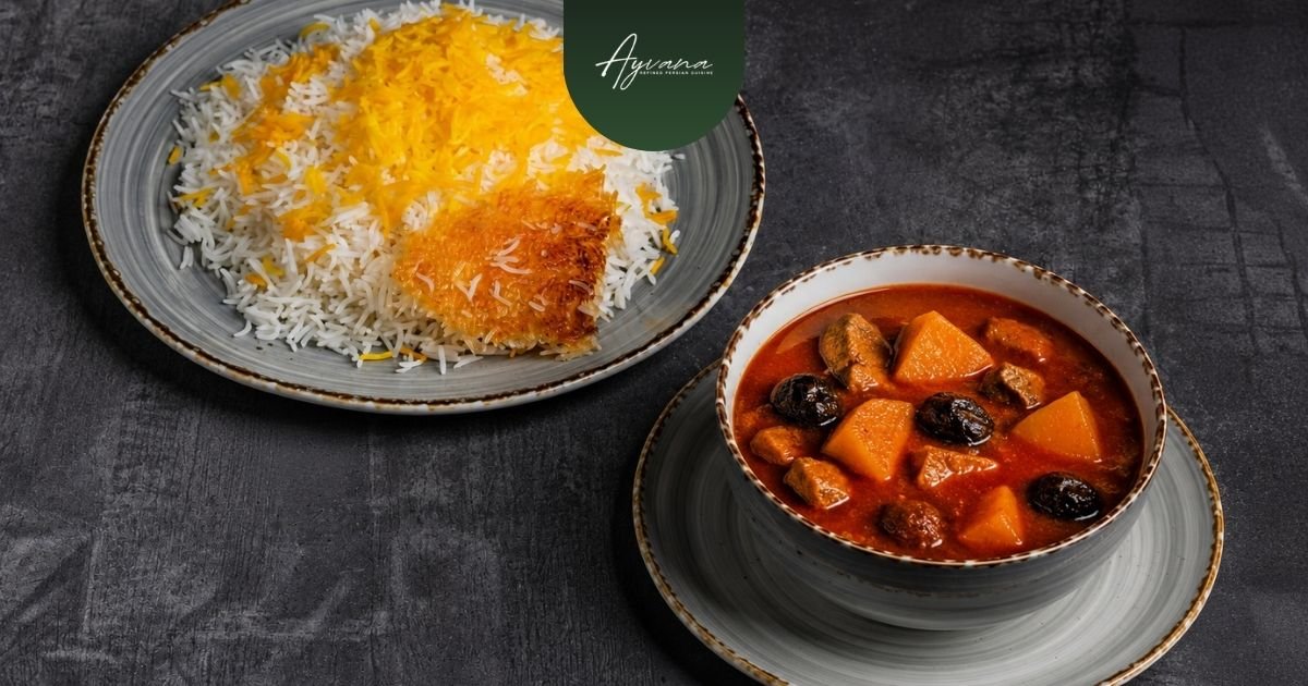 Traditional Khoresh Beh quince stew served beside saffron rice with crispy tahdig on rustic ceramic dinnerware plates.