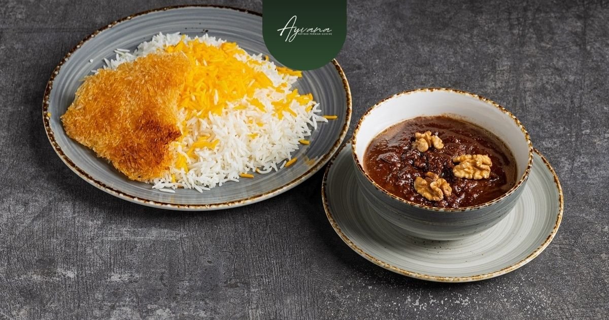 Traditional Khoresh Fesenjan stew with walnuts and pomegranate sauce served beside Persian saffron rice and crispy tahdig.