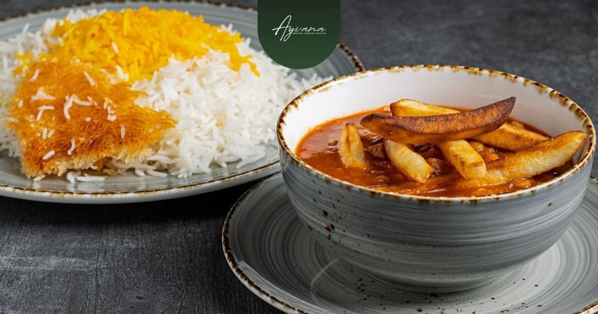 Traditional Persian Gheymeh stew topped with crispy fries served beside saffron rice and golden tahdig crust.