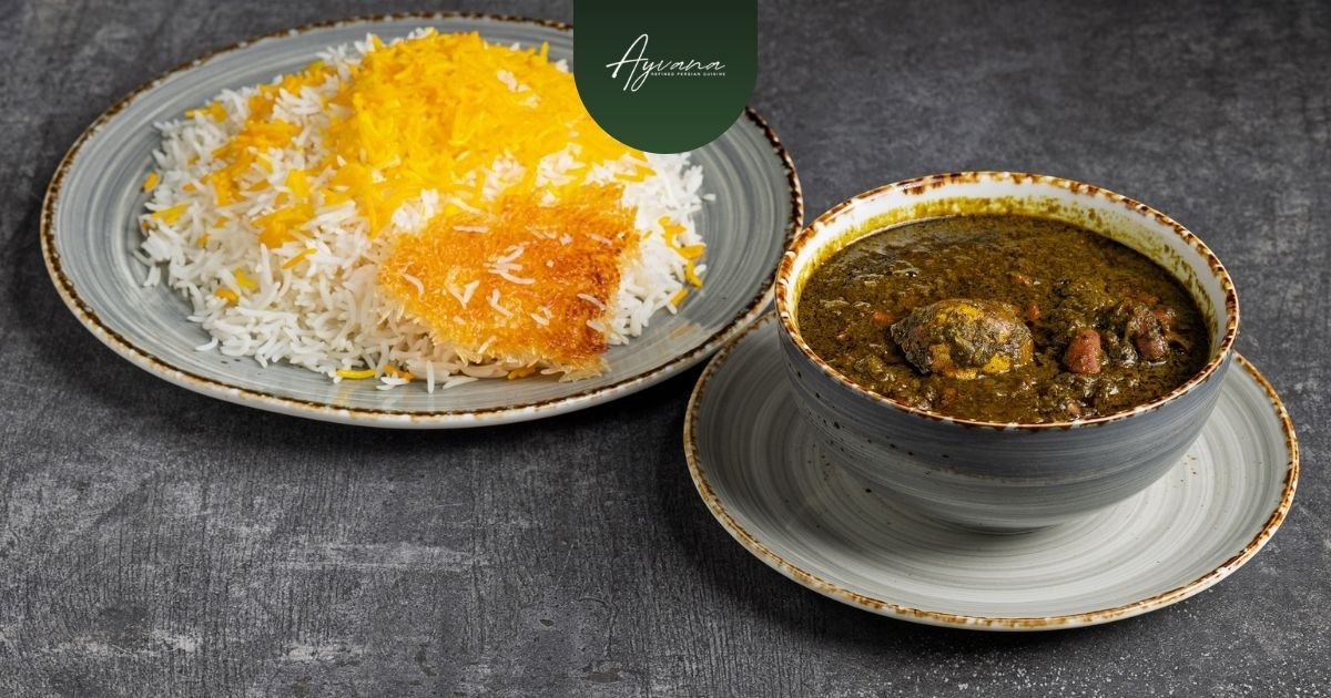 Vegetarian ghormeh sabzi stew with herbs, beans, dried lime served with Persian rice, rich earthy traditional dish