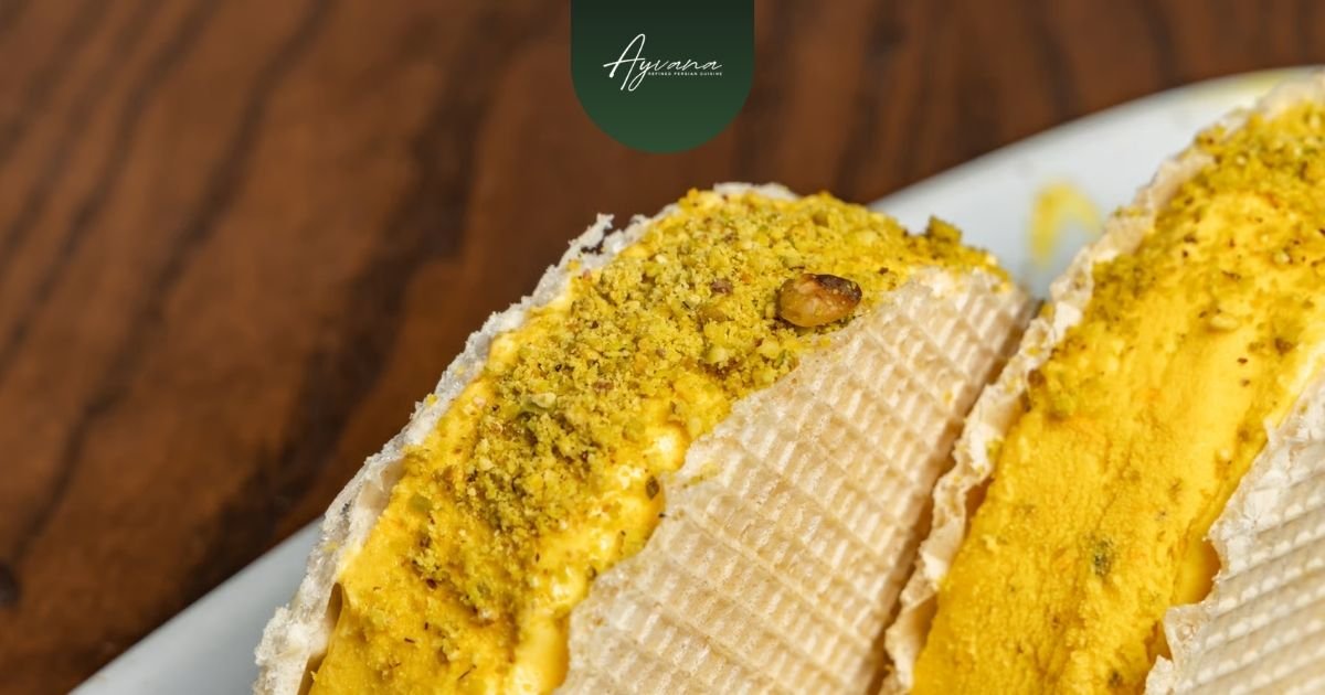 Traditional Persian bastani ice cream with saffron, rosewater, and chopped pistachios in a waffle sandwich