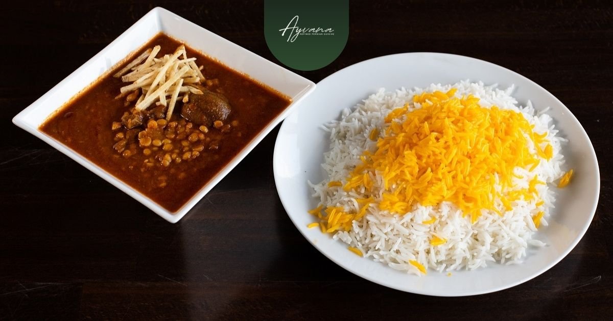 Persian Gheymeh stew served beside saffron rice, featuring comforting savory flavors and traditional Persian dining presentation
