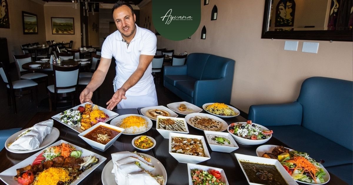Restaurant owner presenting authentic Persian saffron dishes, rice plates, kebabs, salads, and stews inside elegant dining space.