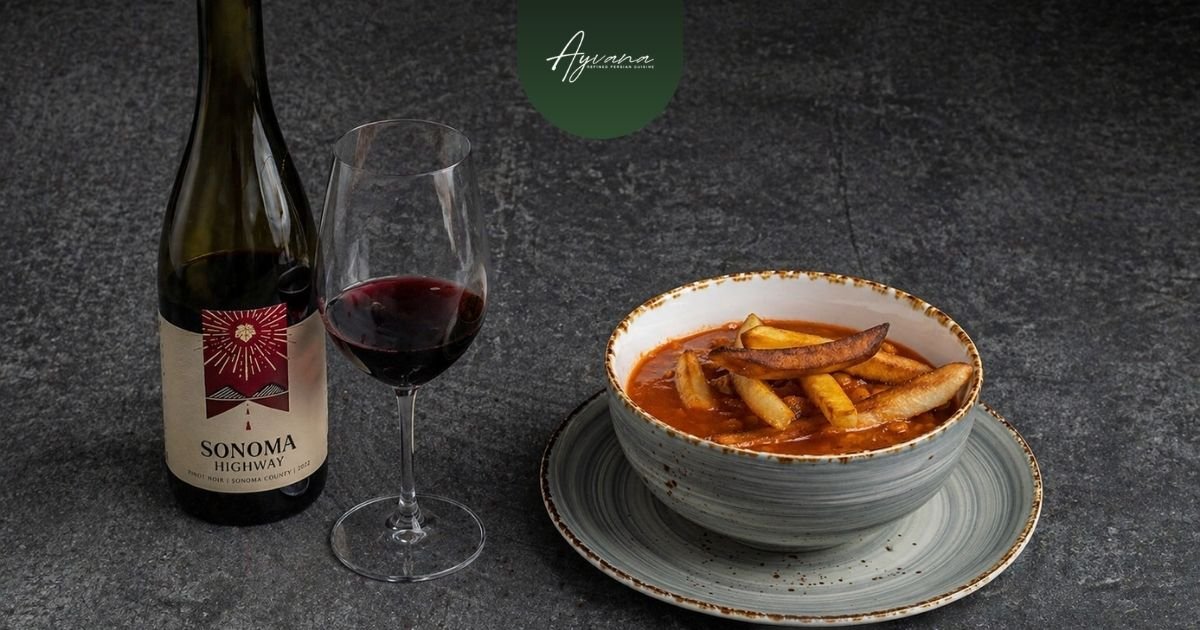 Sonoma Highway Pinot Noir with Persian stew showing balanced wine pairing alongside rich, slow-cooked khoresh dish